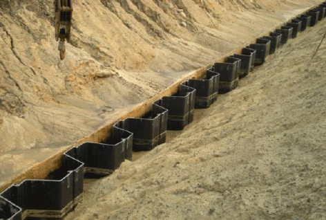 Installing a sheet pile cutoff wall to slow leakage through a dam